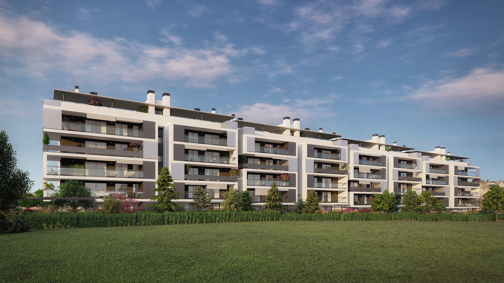 Infografía de la fachada alargada de la promoción residencial de Zaragoza al anochecer