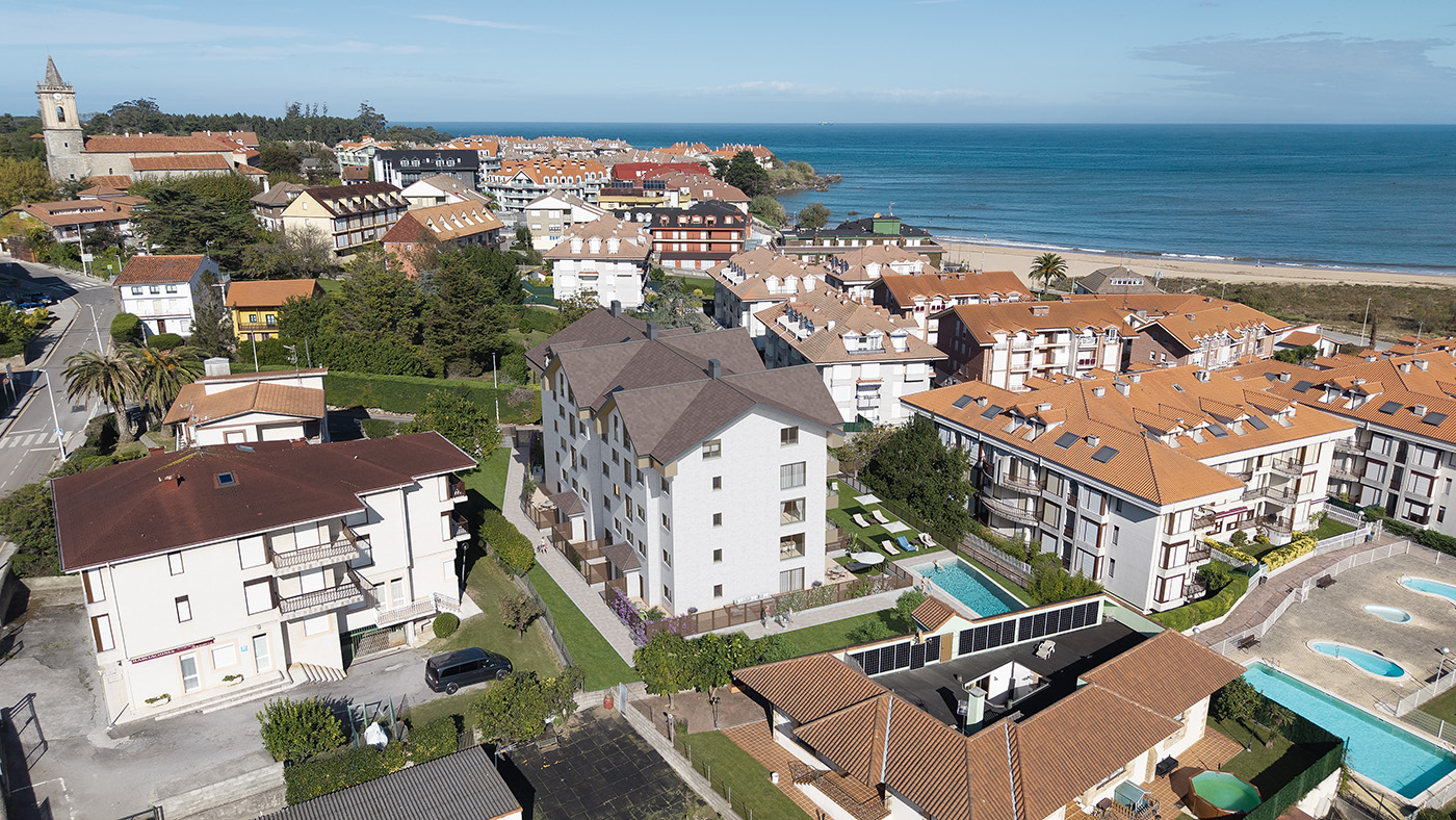Vista aérea del residencial Trengandín con la iglesia de Noja, la playa y el mar Cantábrico al fondo